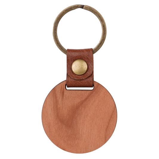 Brown leather keychain with a round wooden tag and gold accent on a white background