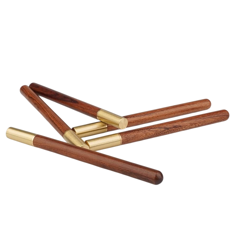 Set of wooden sticks with gold accents on a white background